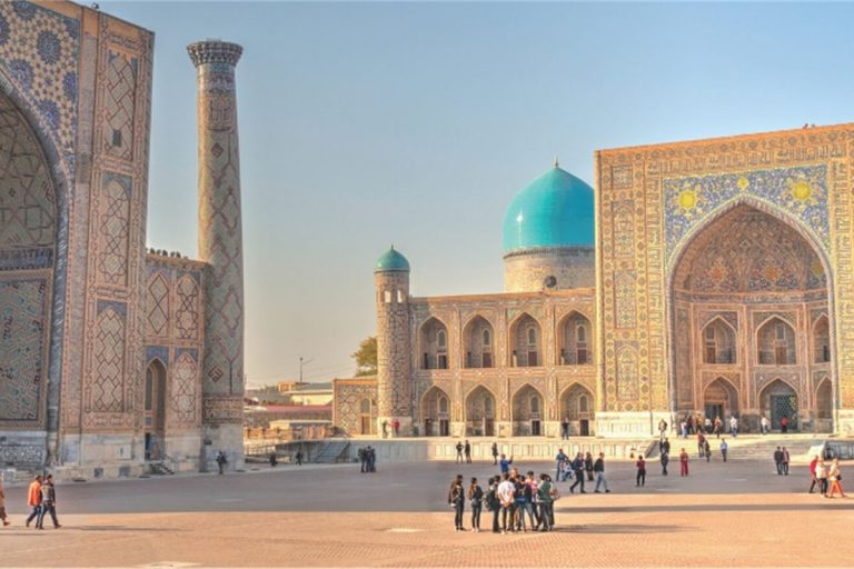 A group of people in front of a building