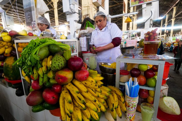 The best attraction in the town of San Pedro de Mala: its food A person standing in front of a fruit stand