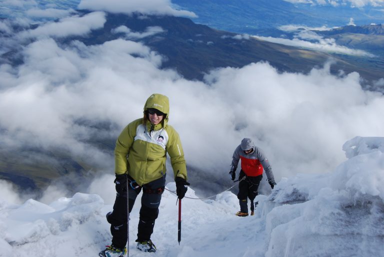 Ascension to Cotopaxi A man standing on top of a snow covered slope