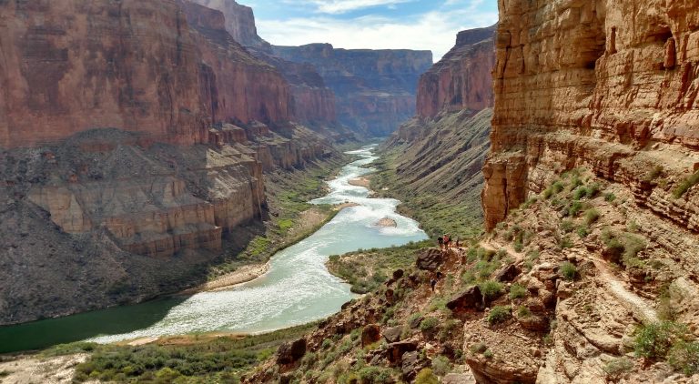 A canyon with a mountain in the background