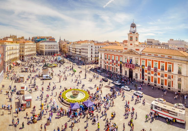 Website with unique plans to do in Madrid A group of people in a city