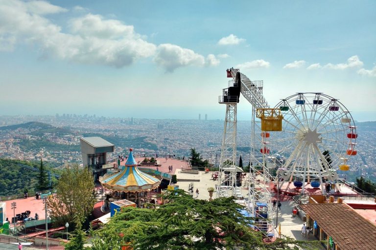 On an excursion to Tibidabo A group of people standing next to a body of water